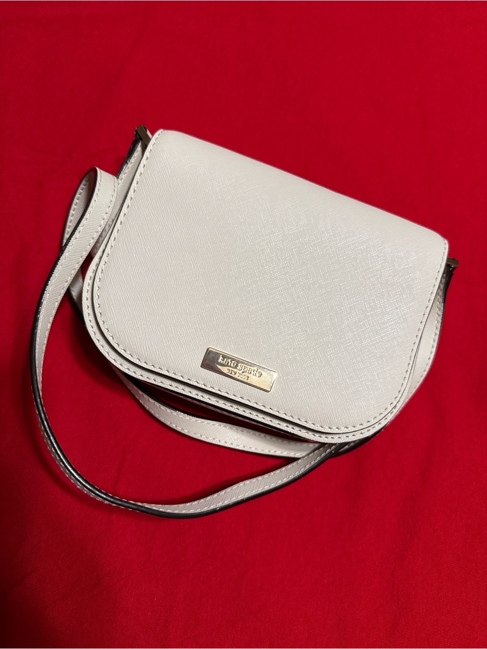 kate spade Ivory Crossbody Saddle Bag with Gold Plaque